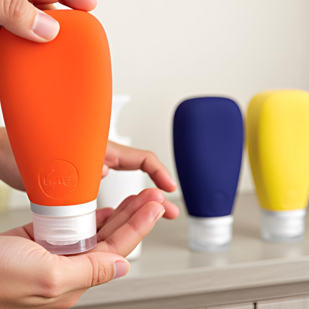 LYOB Travel Bottles for Toiletries, TSA Approved 3oz Leak Proof Silicone Refillable Squeeze Travel Size Containers BPA Free for Cleansers, Lotions, Shampoo 3pk (Orange-Blue-Yellow).